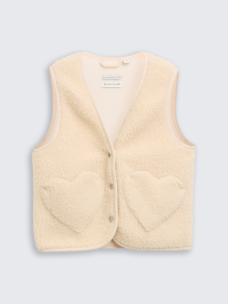 chaleco de peluche con bolsillos de corazón y forro polar.