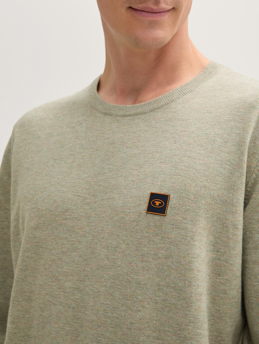 jersey de punto con insignia de logotipo