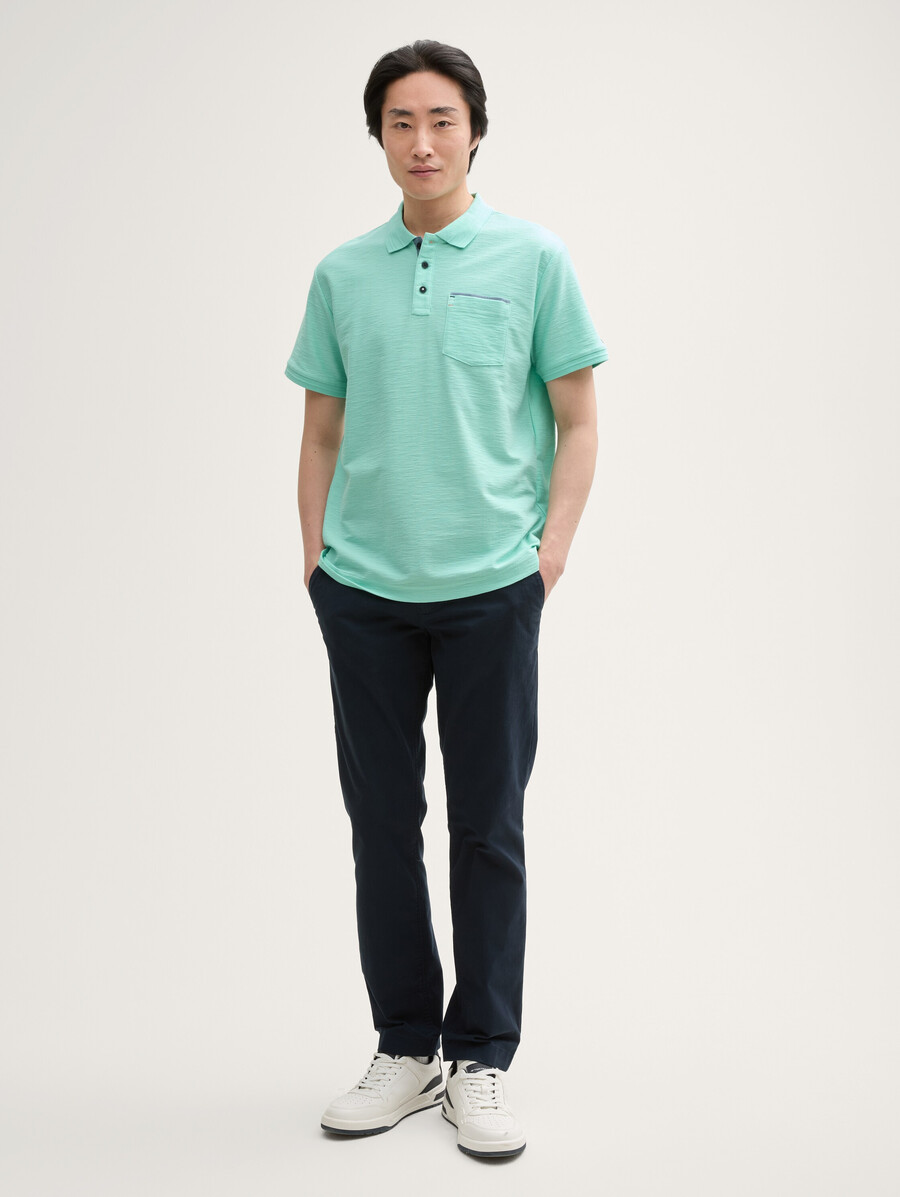 camisa polo con bolsillo en el pecho