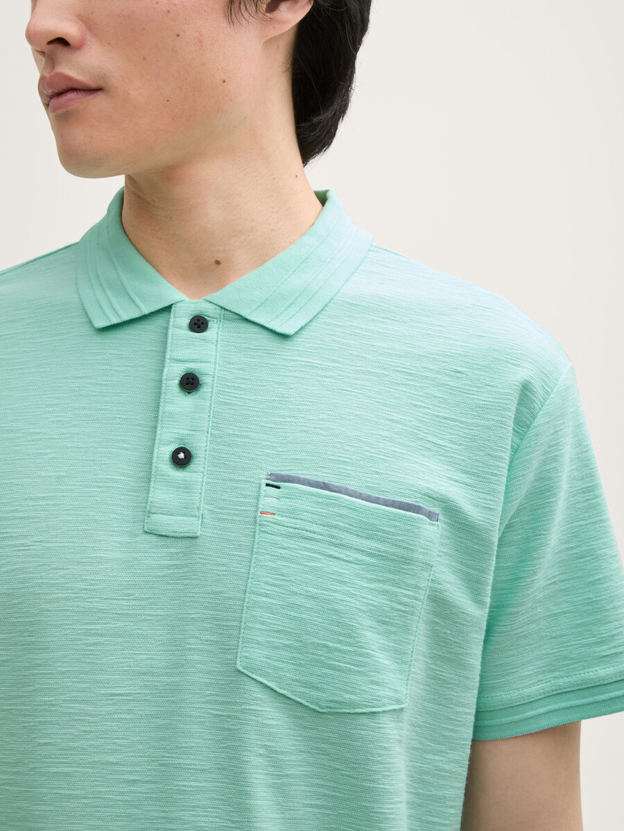 camisa polo con bolsillo en el pecho