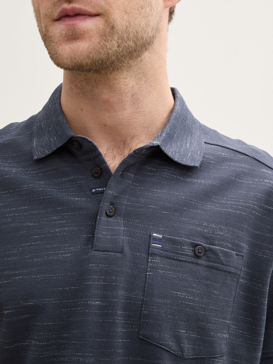 camisa polo con bolsillo en el pecho
