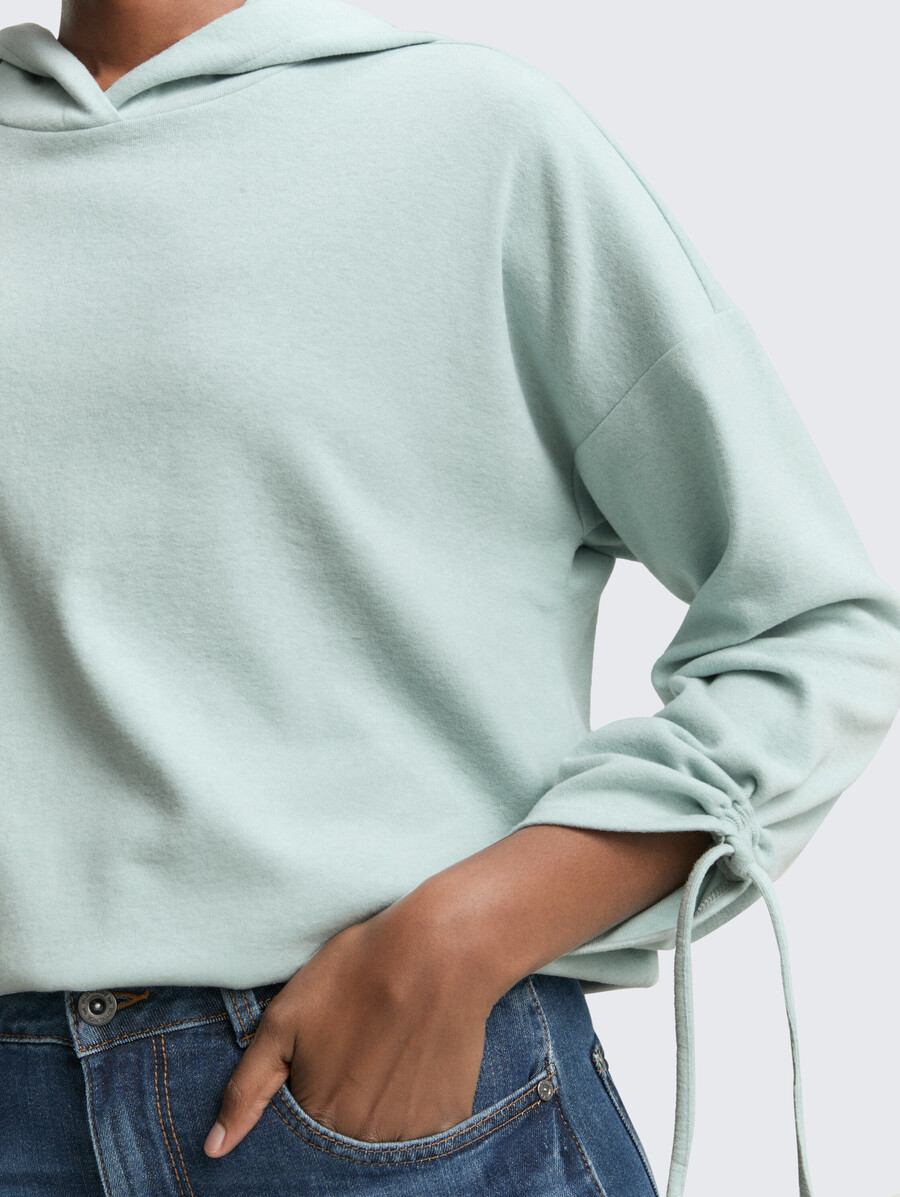 camisa holgada de manga larga con capucha