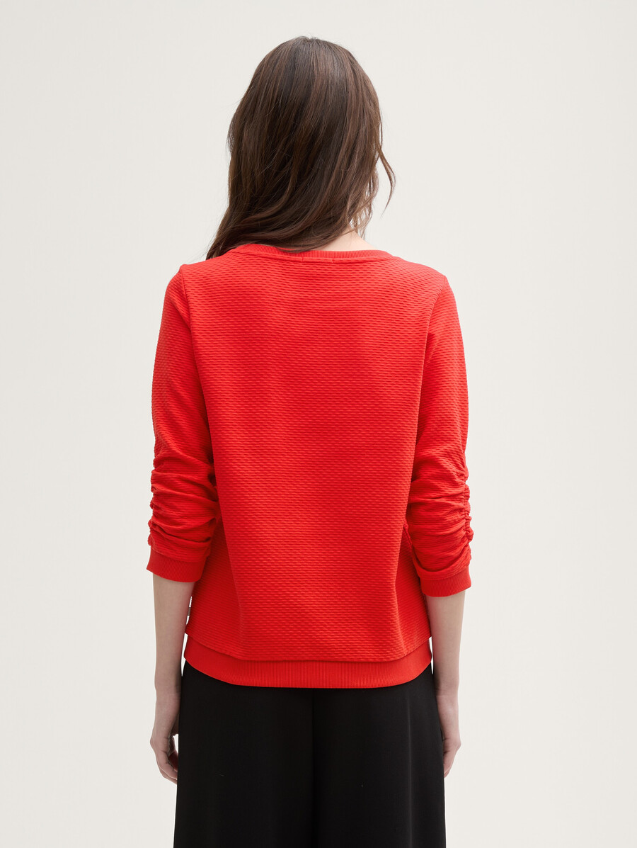 sudadera con volantes