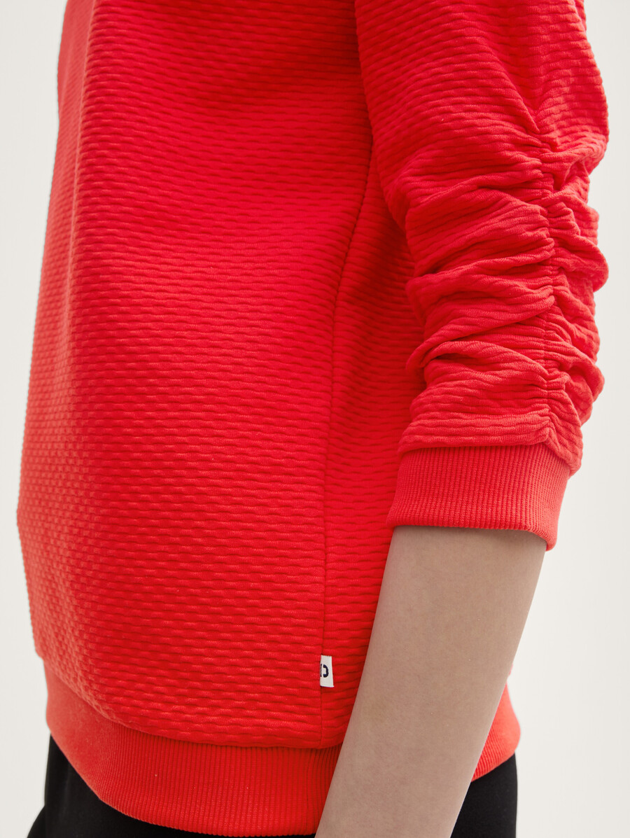 sudadera con volantes
