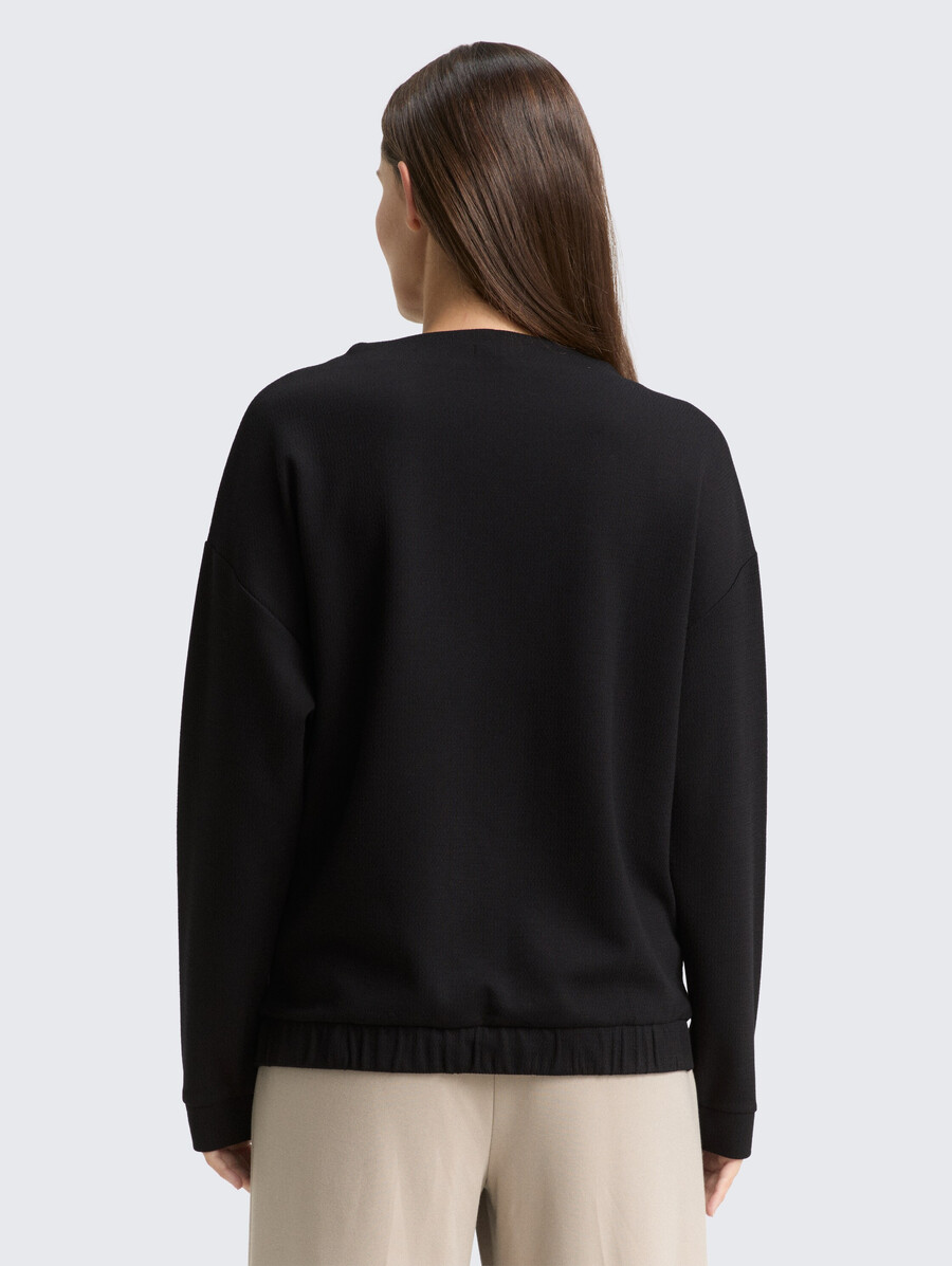 sudadera holgada con cuello alto